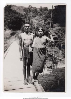 Couple Standing on a Suspension Bridge