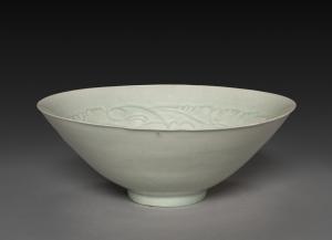 Conical Bowl with Carved Babies and Floral Motif