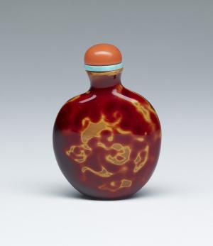 Snuff Bottle with Dragon-like Forms, in Imitation of Carnelian