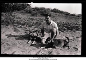 John Hurden and dogs on beach